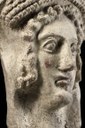 "DeVoti Etruschi", testa femminile con tracce di trucco